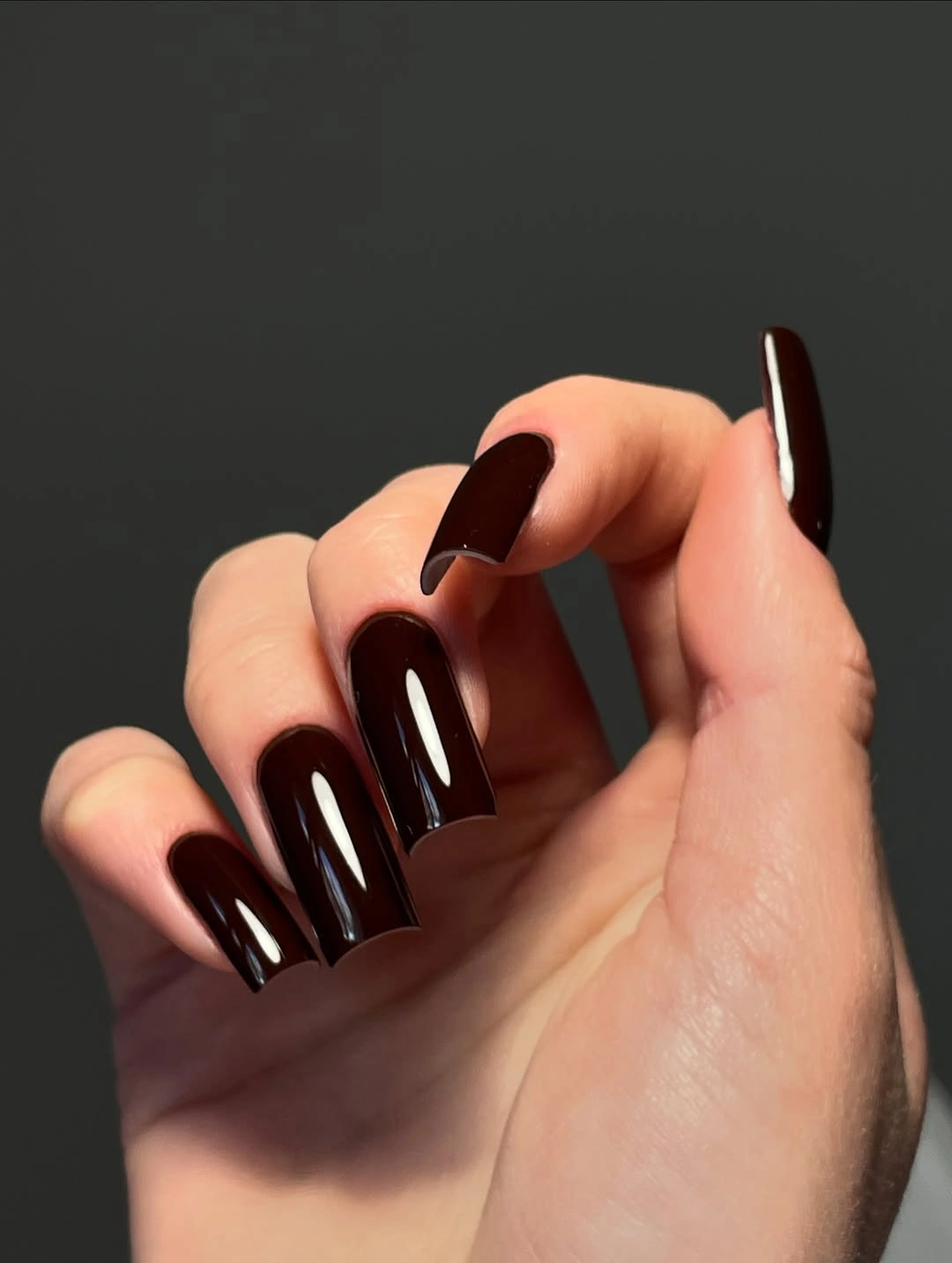 Long square nails with dark glossy chocolate polish
