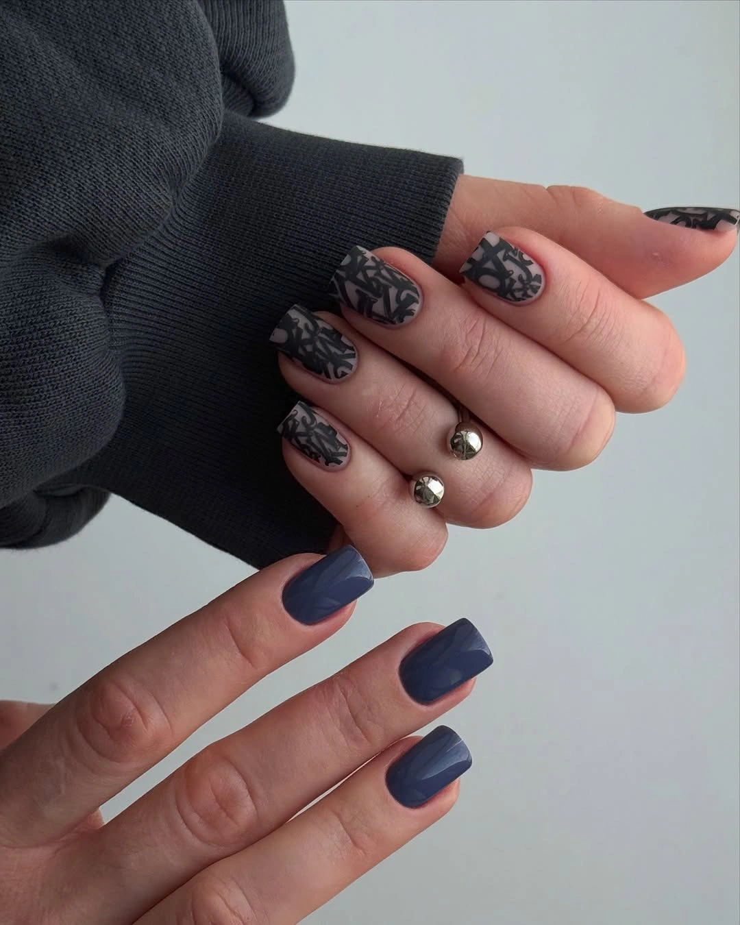 Short gray square nails with black lines and deep blue accents