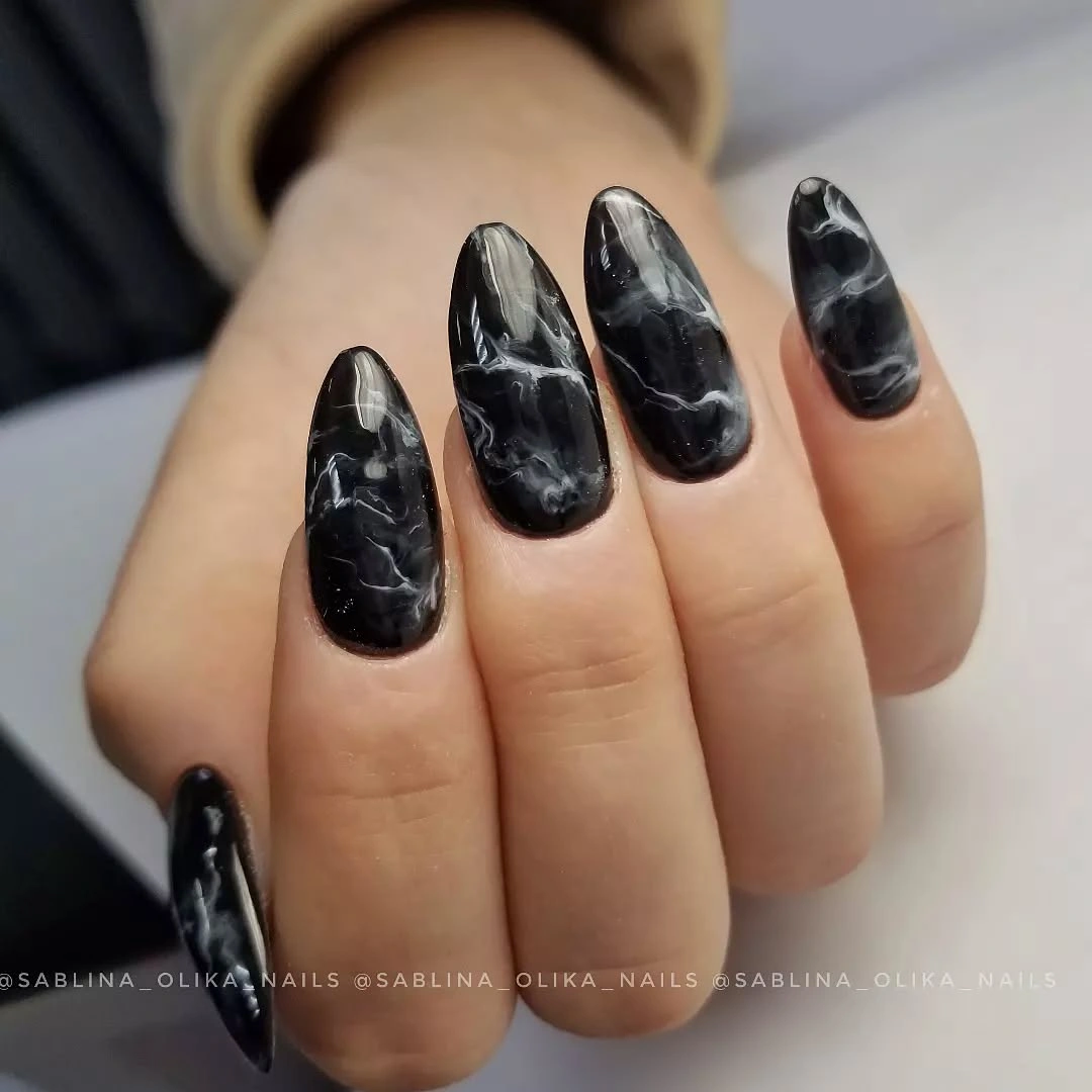Long almond nails with smoky white marbling over black