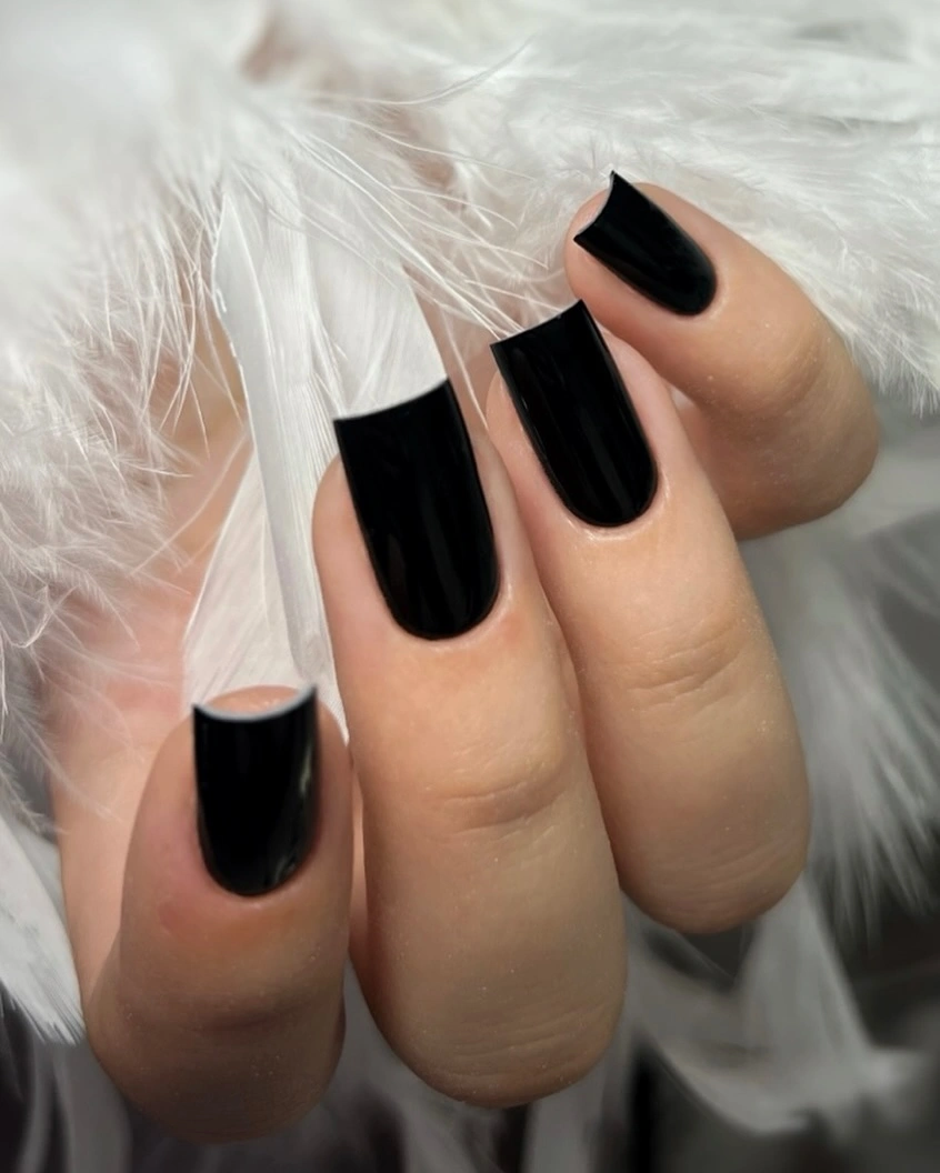 Medium-long square and rounded-square nails in glossy black