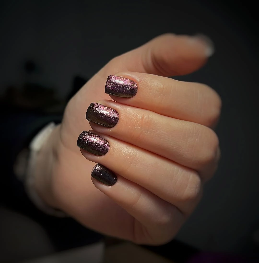 Short square nails in brown-plum glitter
