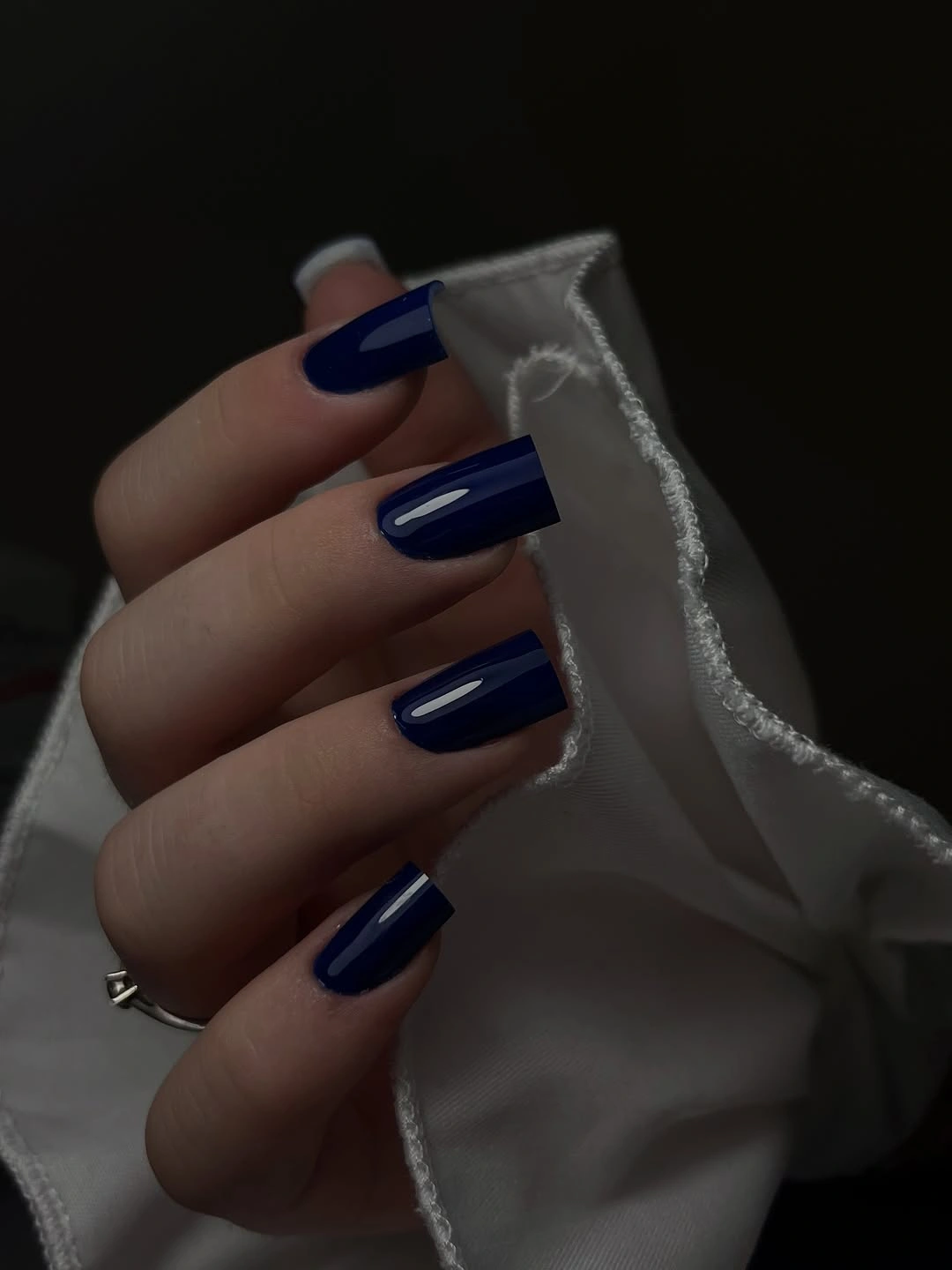 Medium square nails in deep glossy navy blue