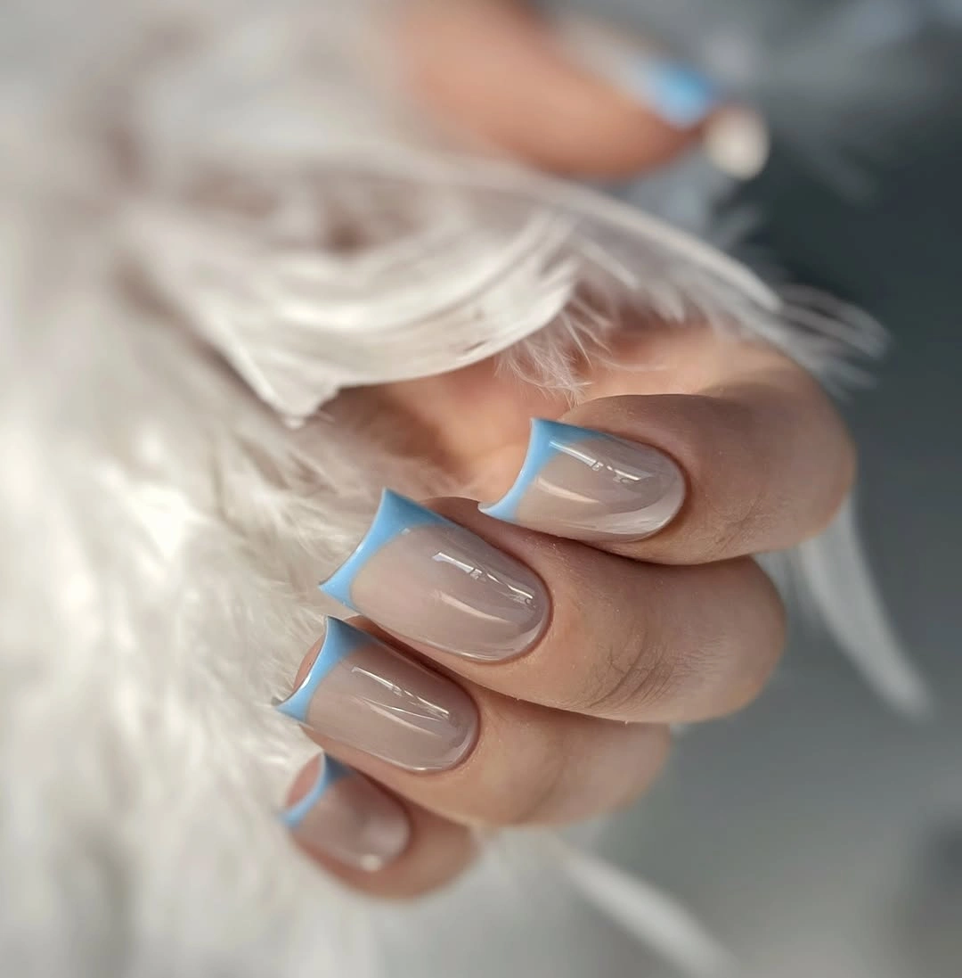 Short nude square nails with vivid sky blue tips