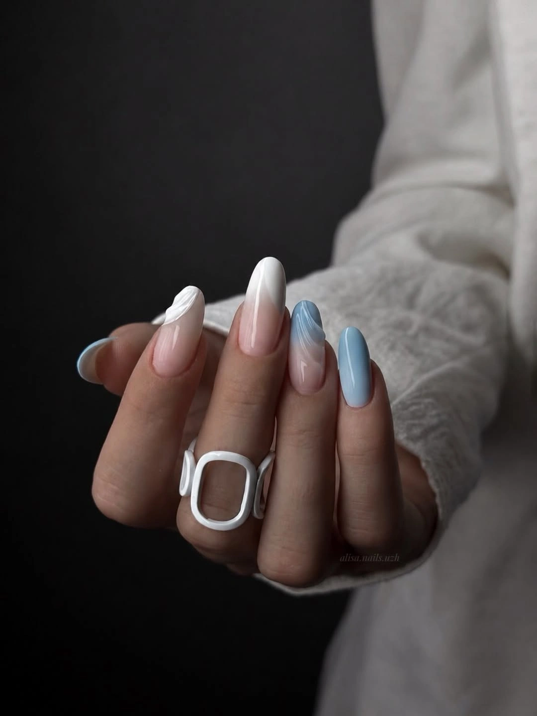 Almond nails mixing milky pink white and pale blue accents
