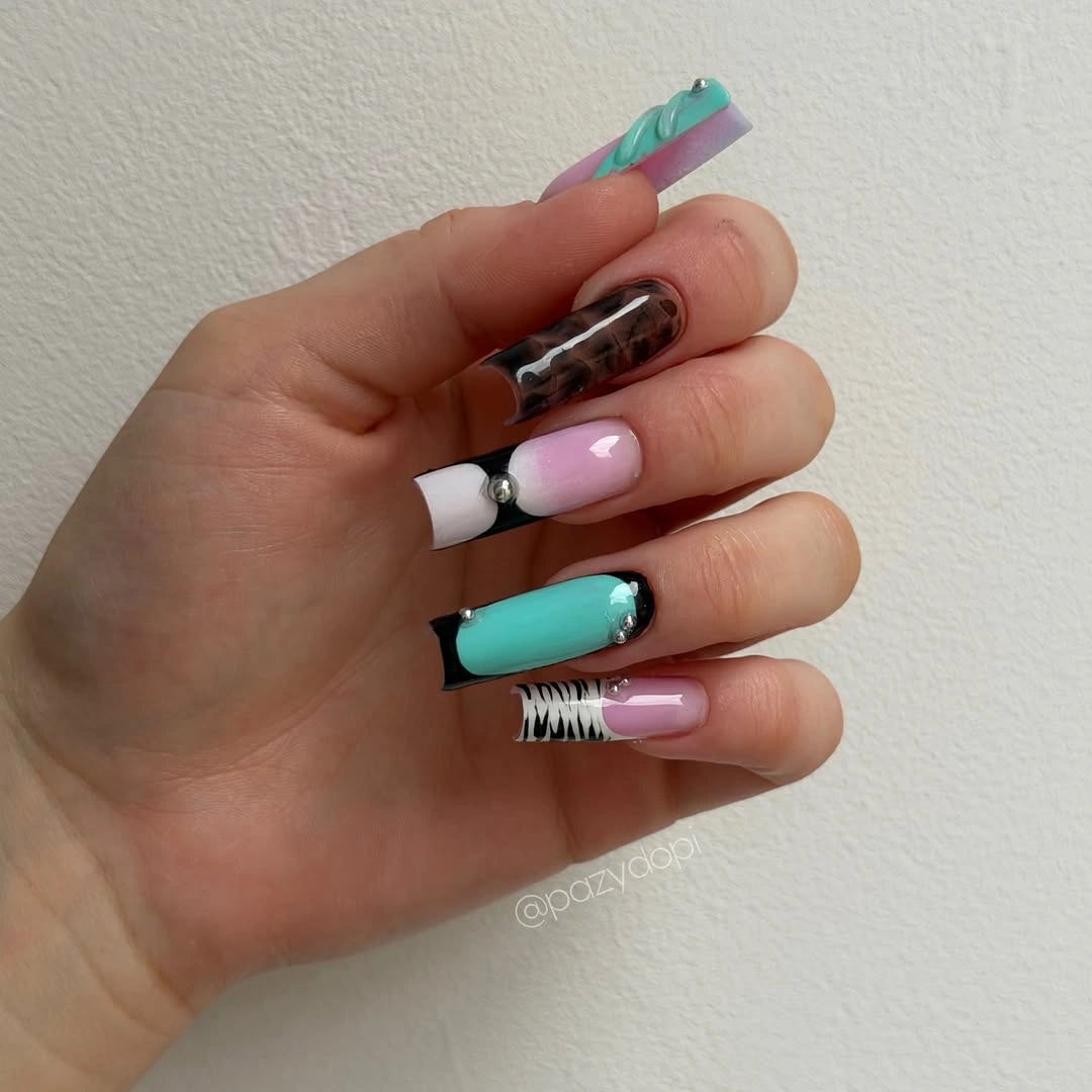 Long square nails with turquoise pink white black and graphic accents