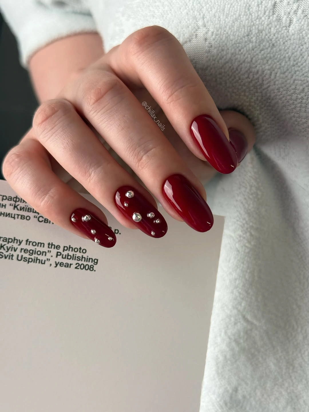 Medium square hot pink nails with white doodles and berry accents