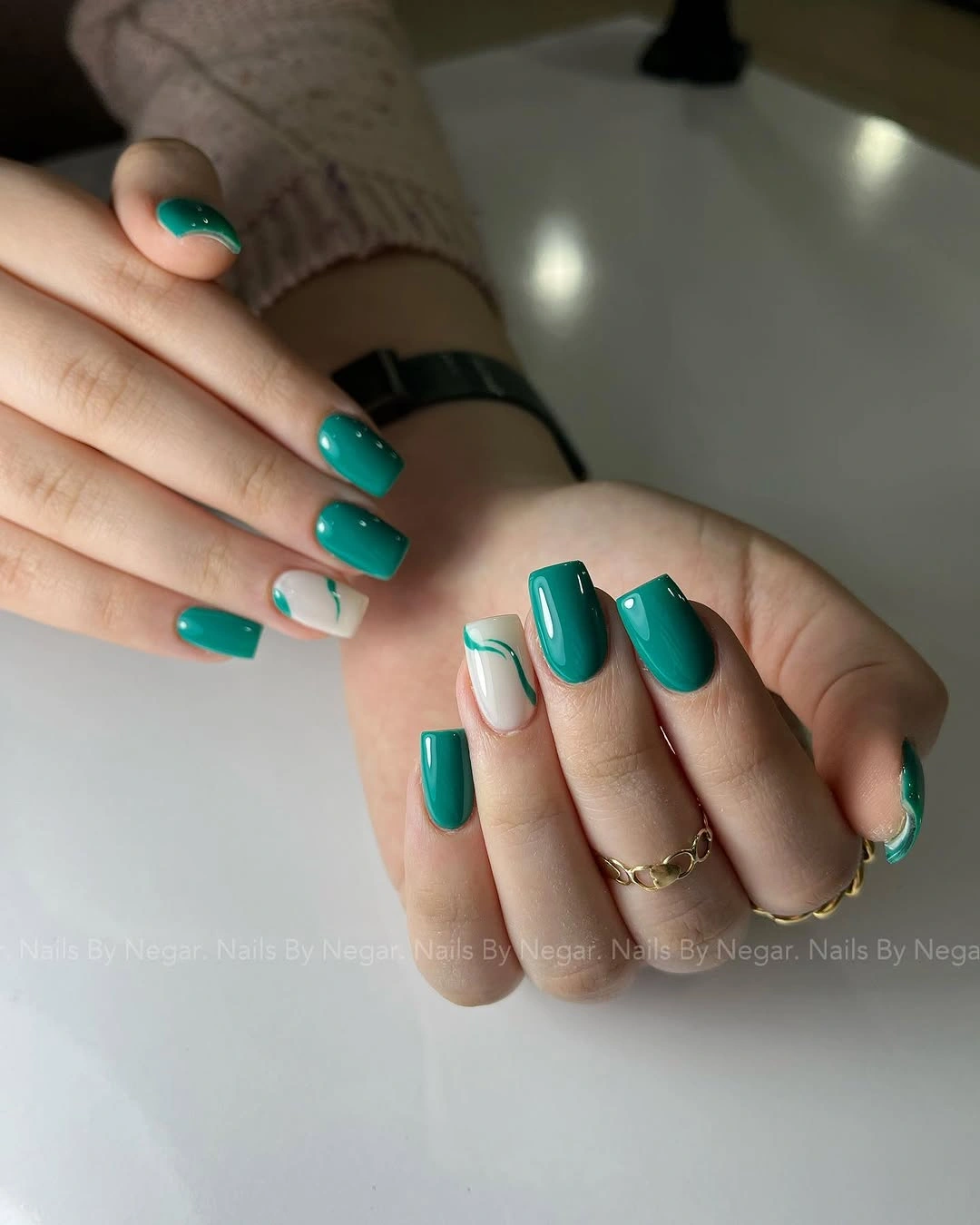 Medium square turquoise nails with pale open accent sections