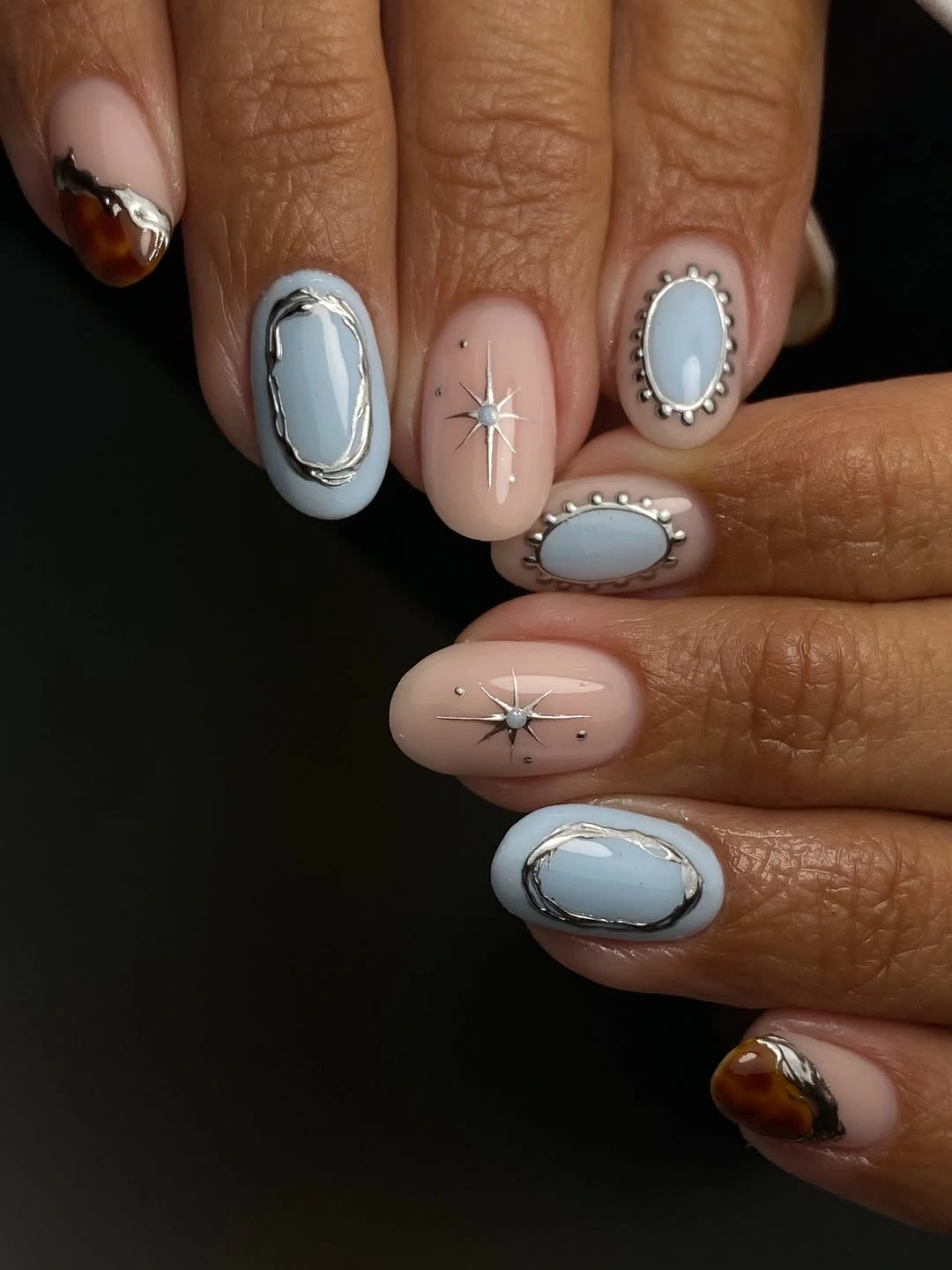 Medium oval blush nails with pale blue framed oval accents