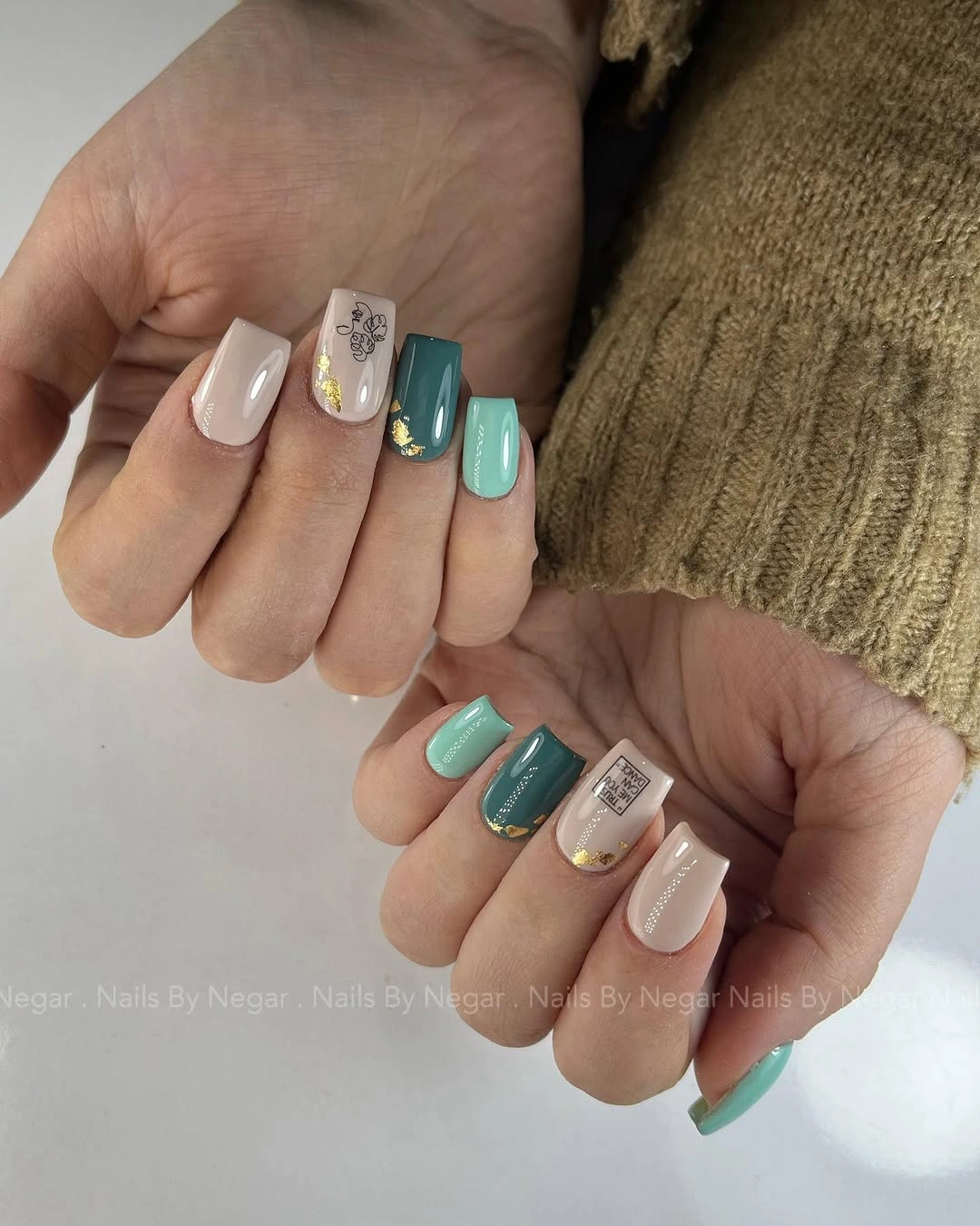 Medium square nails with white yellow turquoise and glitter accents