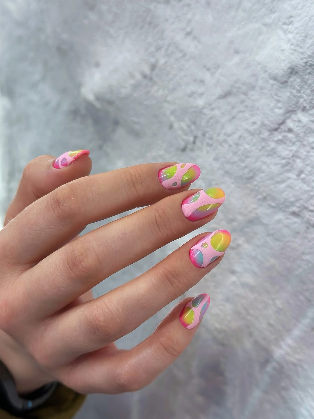 Short pink fall acrylic nails with bright organic swirls