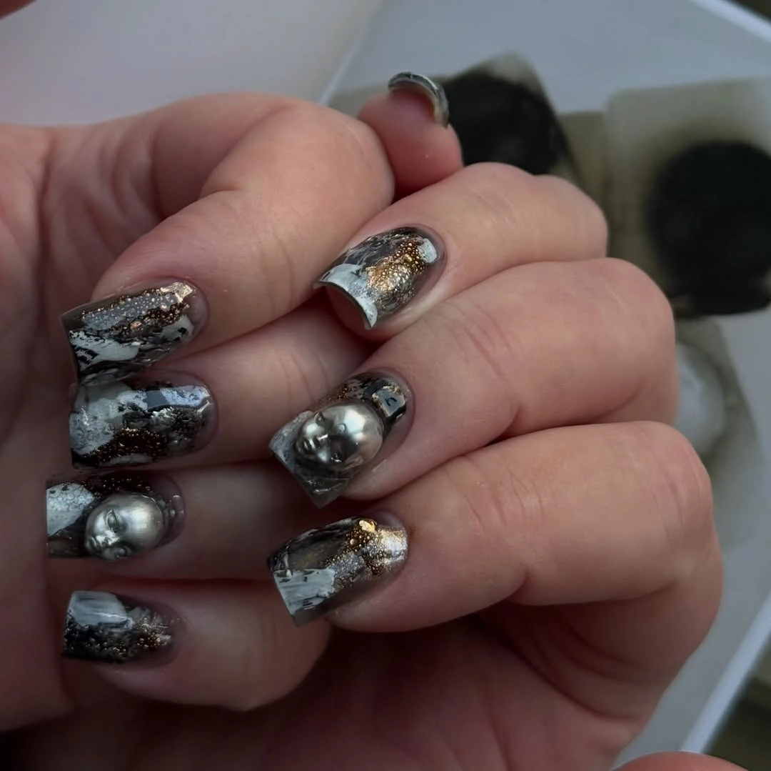 Smoky metallic marble nails with silver dome accents