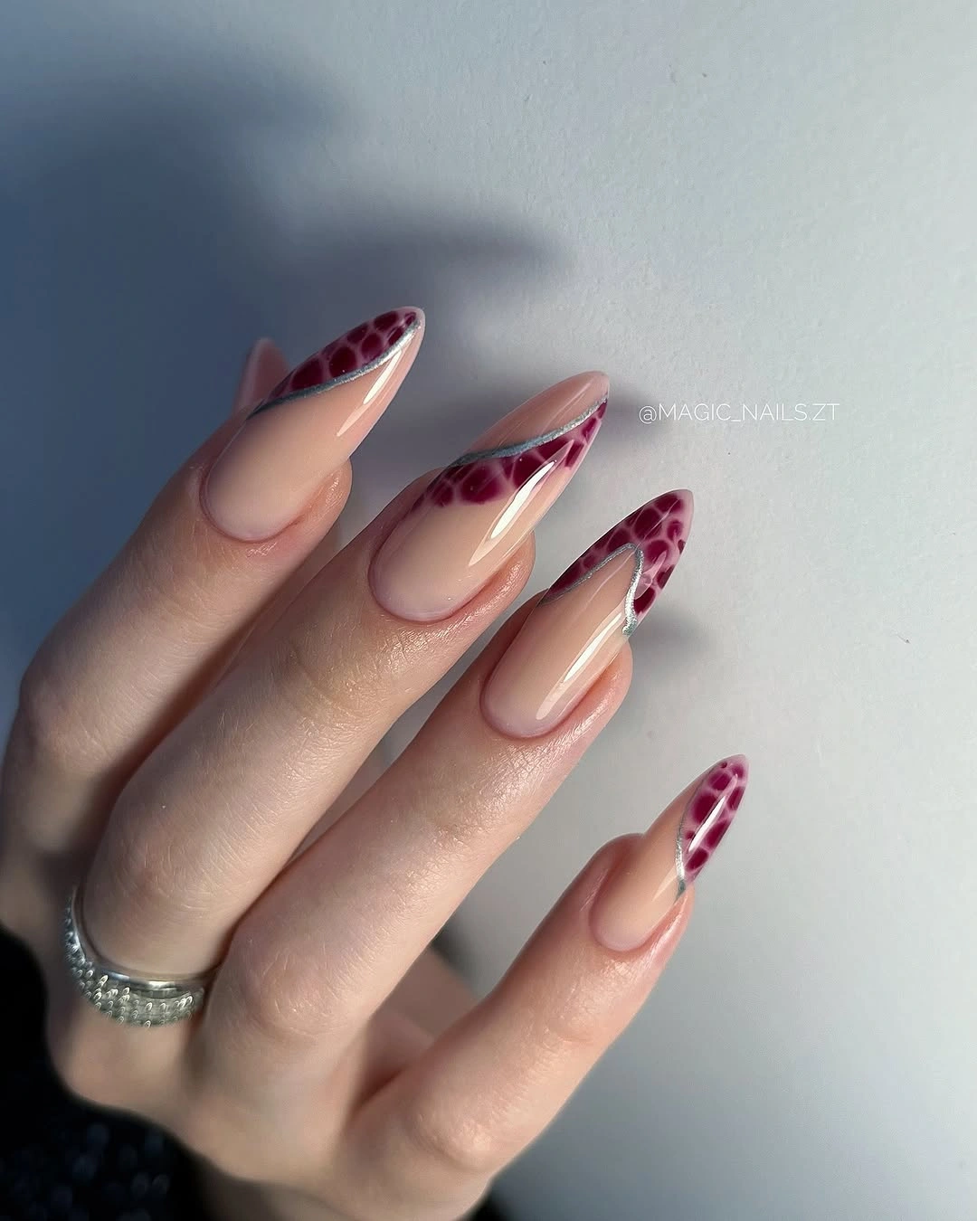 Burgundy animal French tips with silver curves