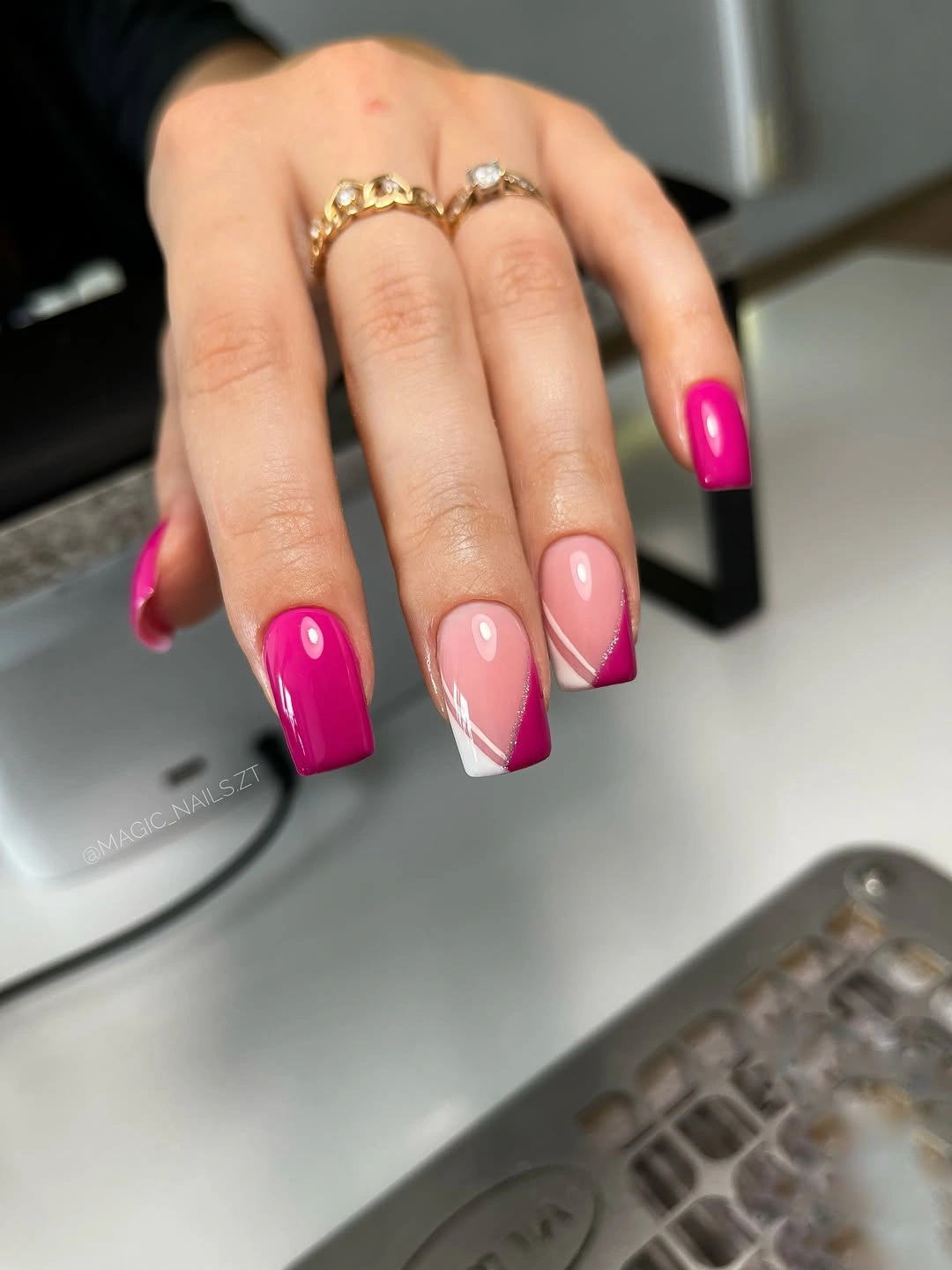 Hot pink square nails with diagonal white accents