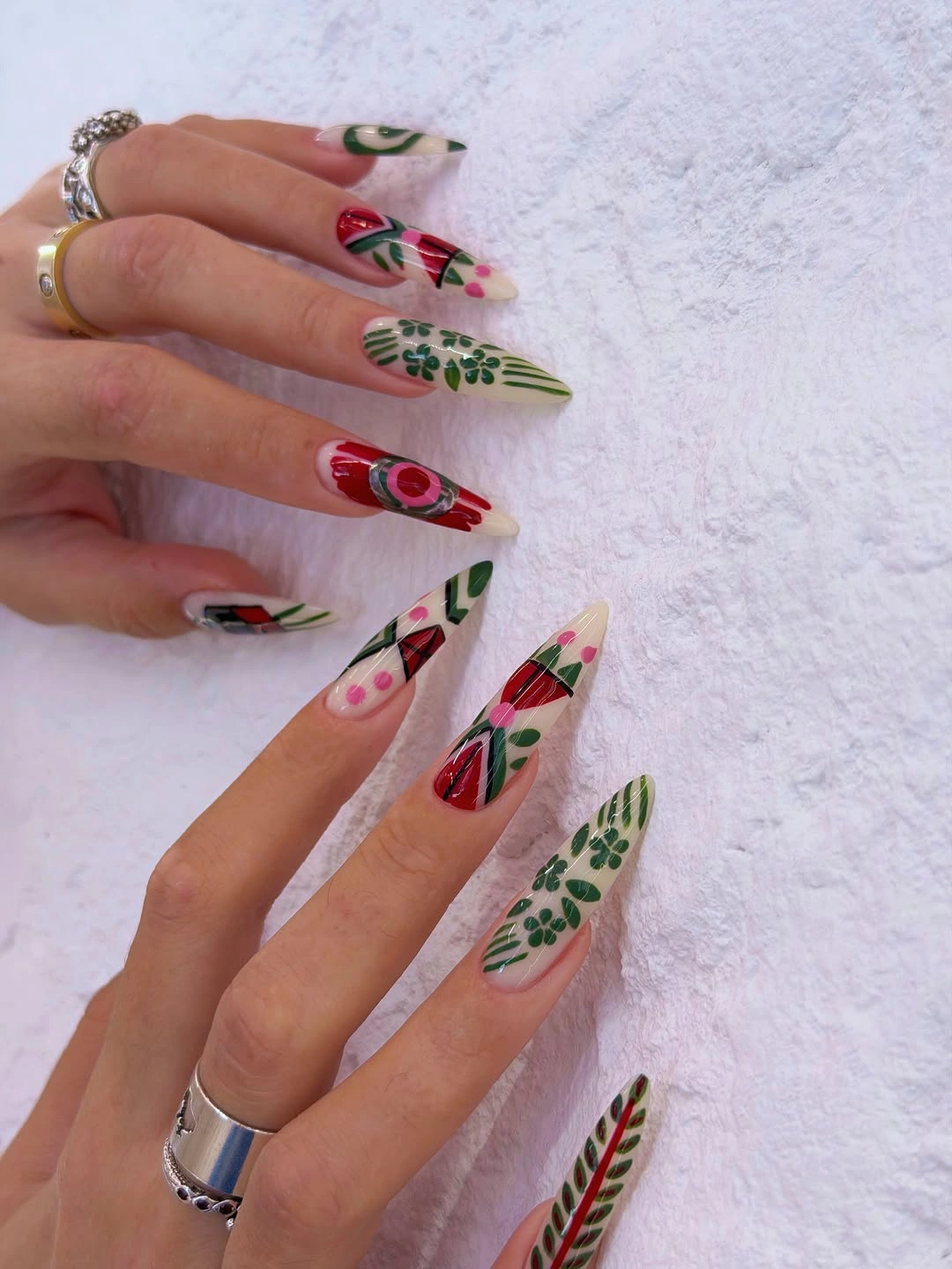 Long botanical fall acrylic nails with red and green details