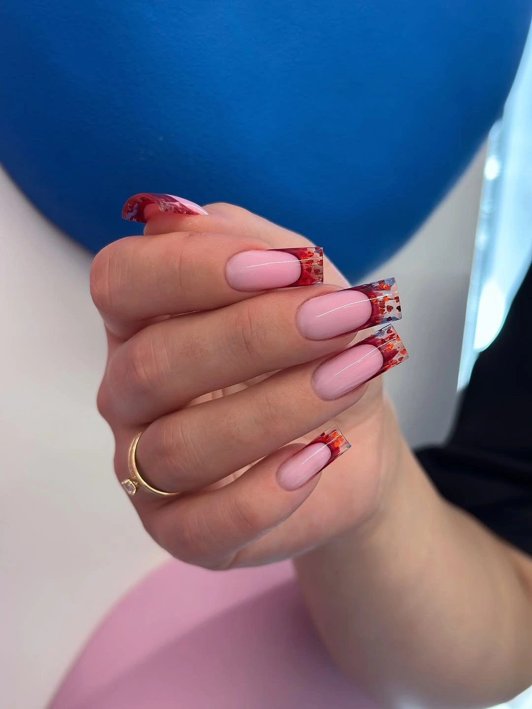 Pink fall acrylic nails with clear red confetti French tips