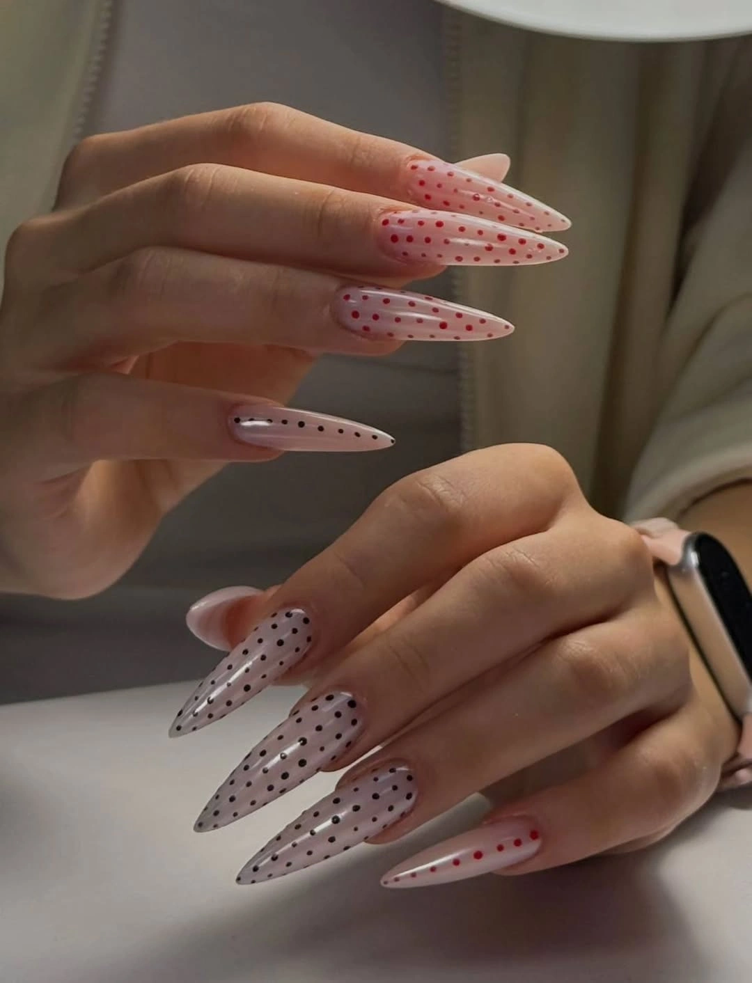 Sheer long stiletto nails with tiny polka dots