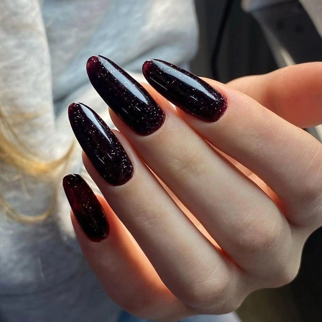 Black cherry oval fall nails with subtle glitter