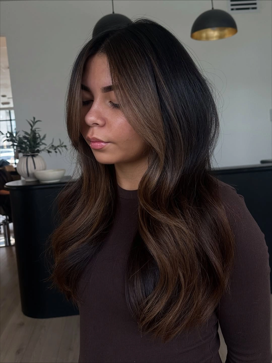 Long dark chocolate waves with low-contrast warm dimension