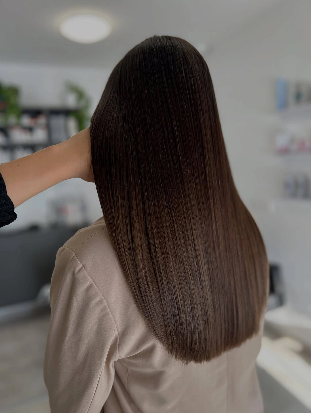Long straight chocolate brown hair with rounded softly blunt ends