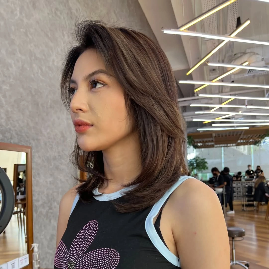 Shoulder-length layered medium brown bob with lifted crown