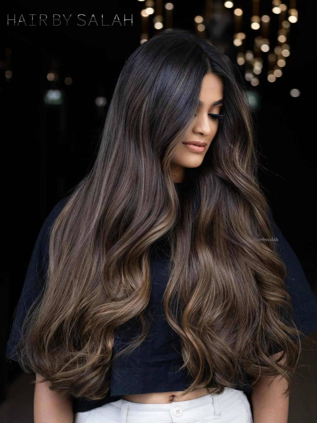 Long dark waves with cool-to-warm brown ribbons