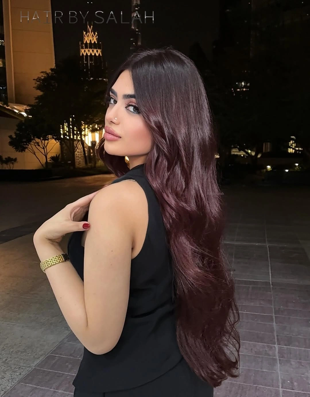 Very long straight hair with a muted plum-brown cast and richer ends