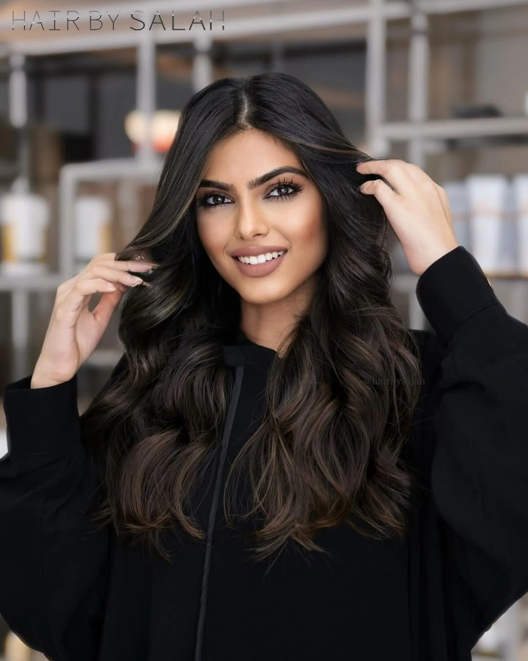 Long voluminous dark waves with warm caramel ribbons through outer layers