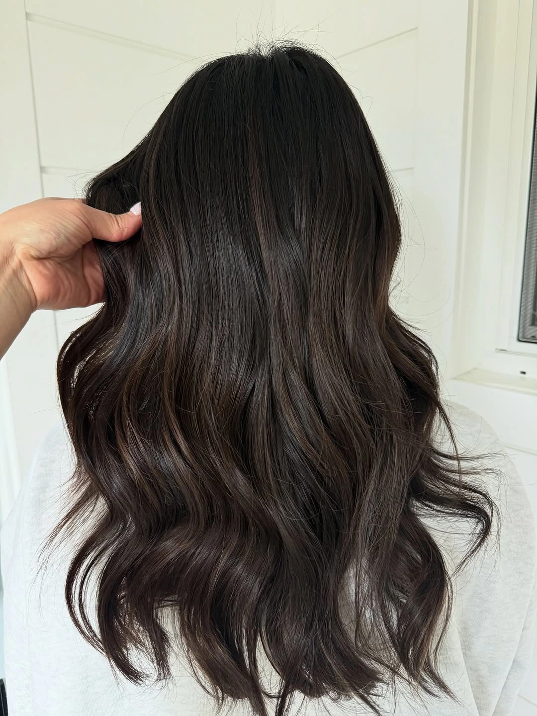 Long dark brown waves with a cool smoky surface