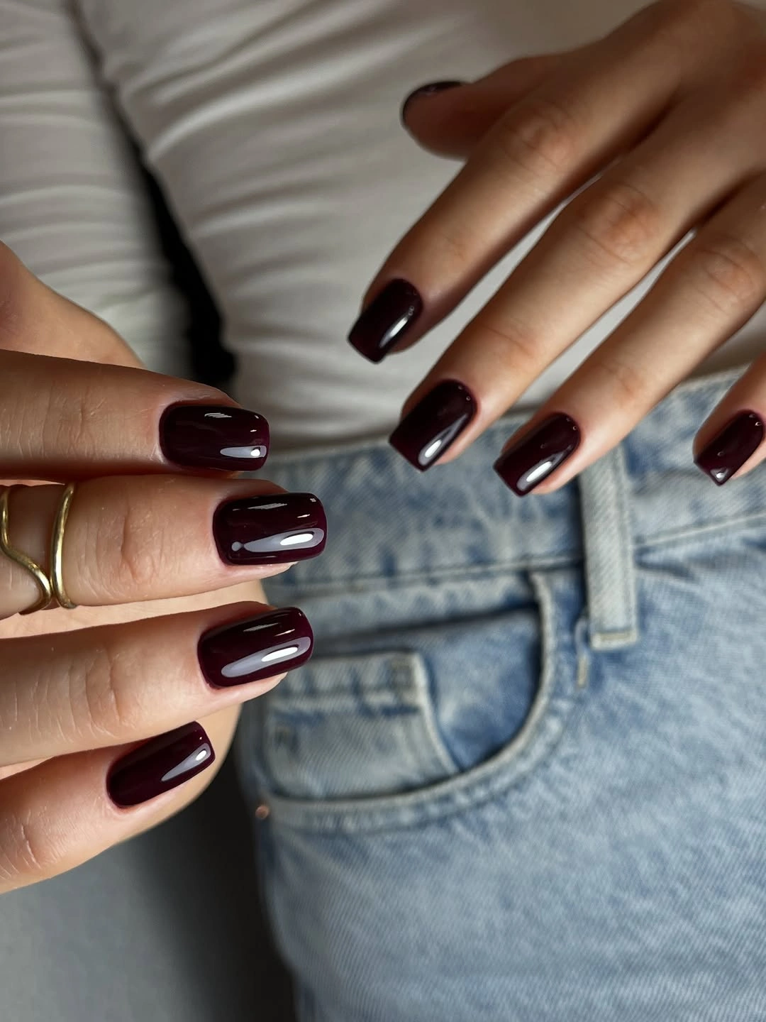Long square burgundy nails with denim and white clothing