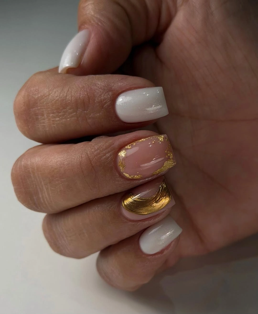 Short square milky white nails with gold framed accent