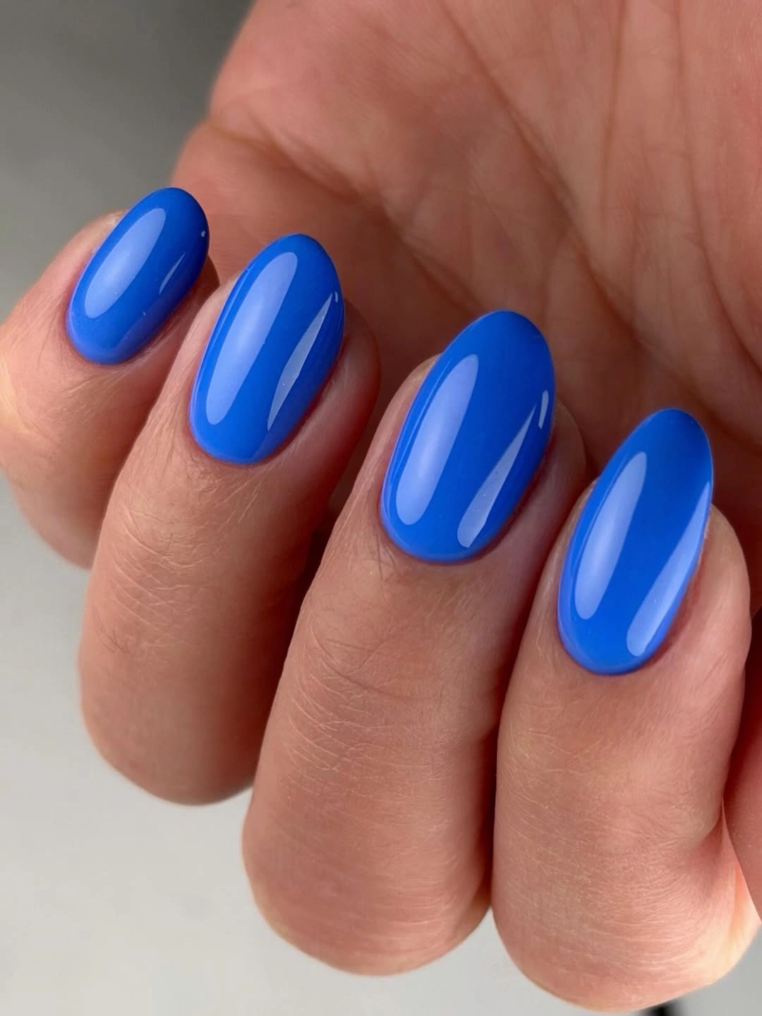 Medium oval nails in glossy electric cobalt blue