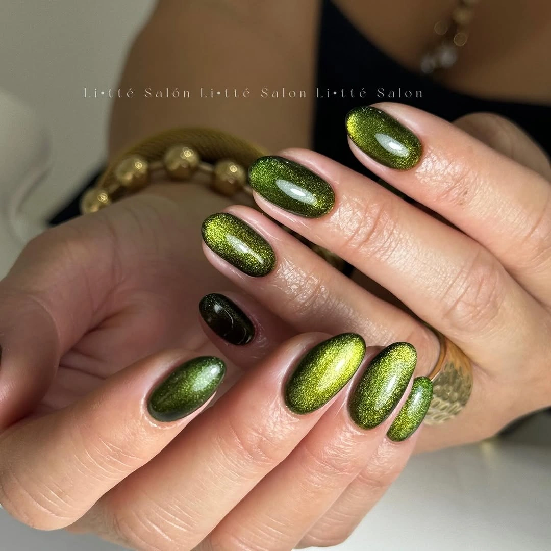 Medium oval olive green nails with reflective metallic shift