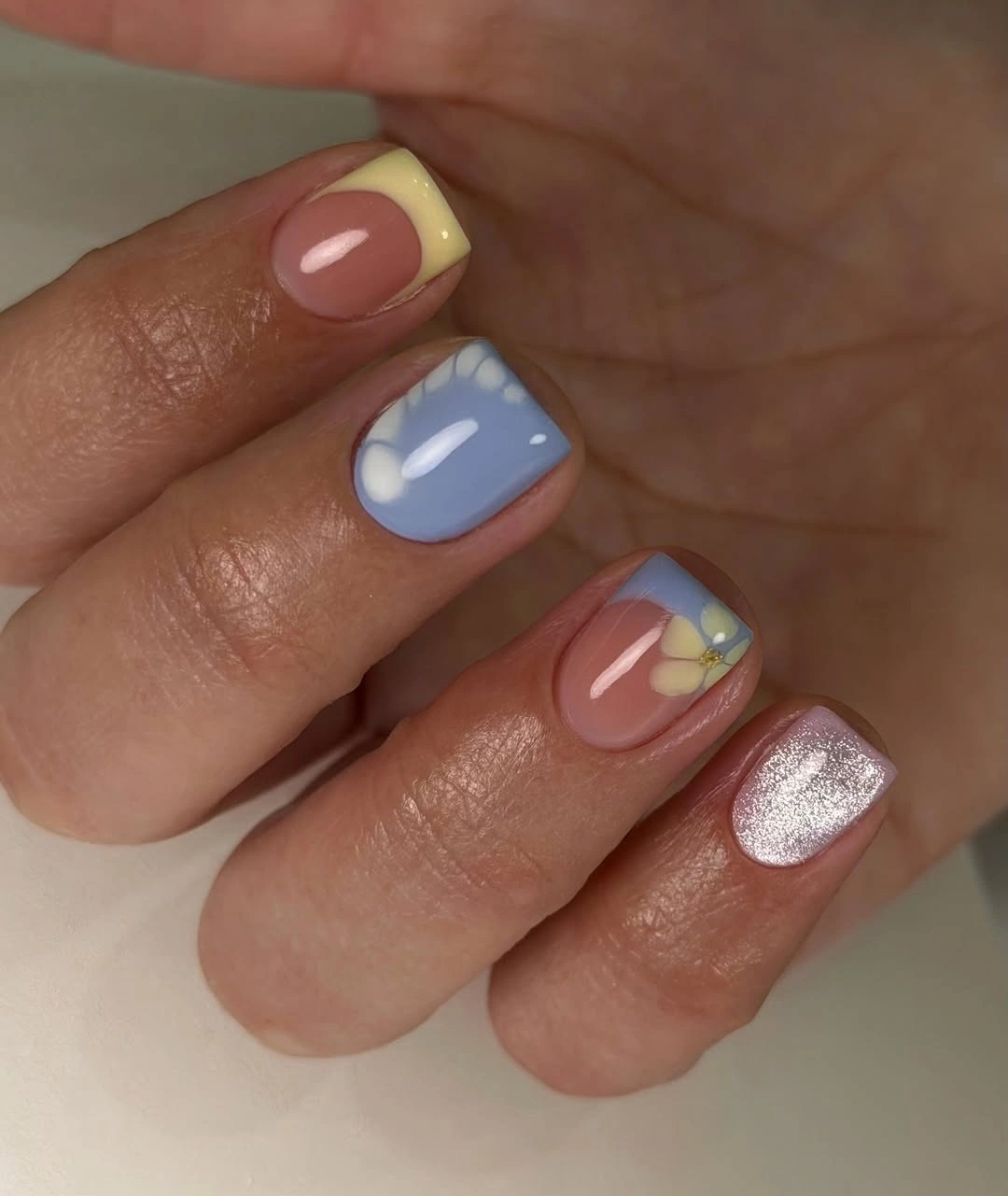 Short pastel rose blue yellow and silver accent nails