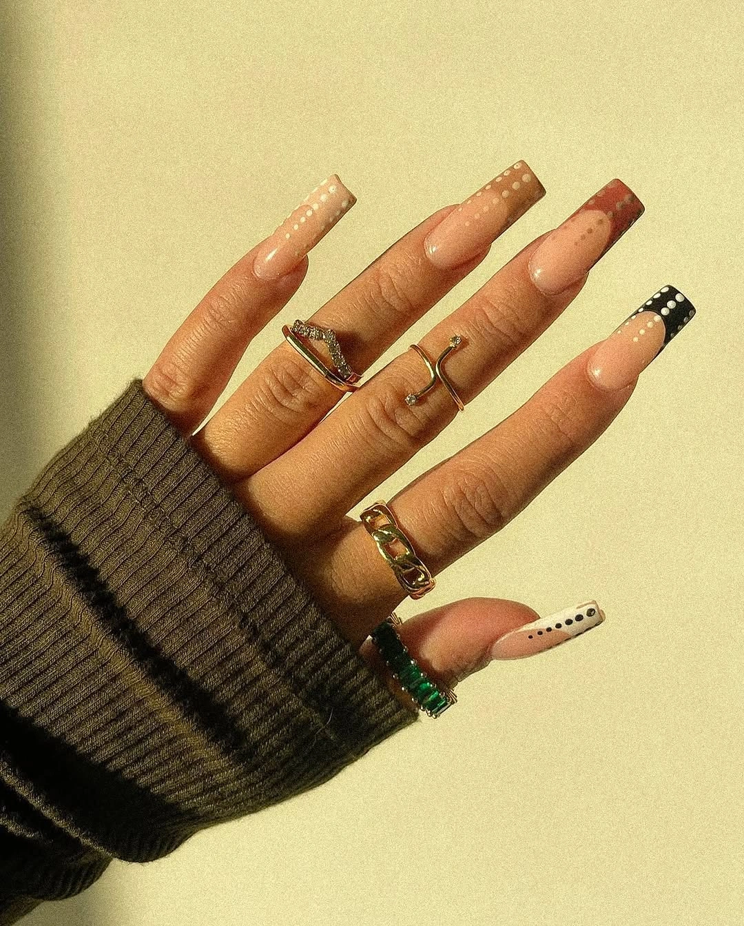 Long peach coffin nails with varied French edges and fine lines