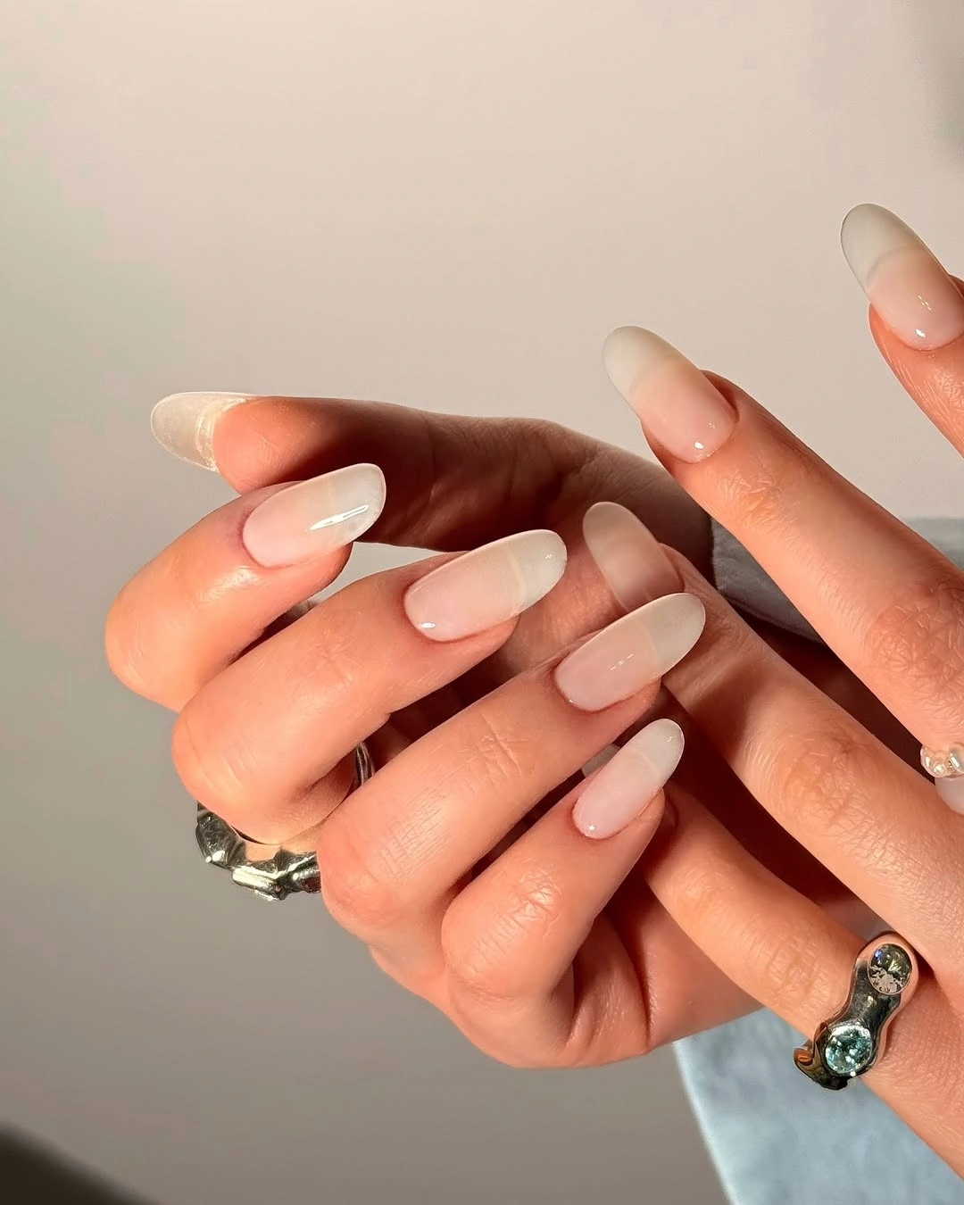 Long almond nails with soft white fading tips