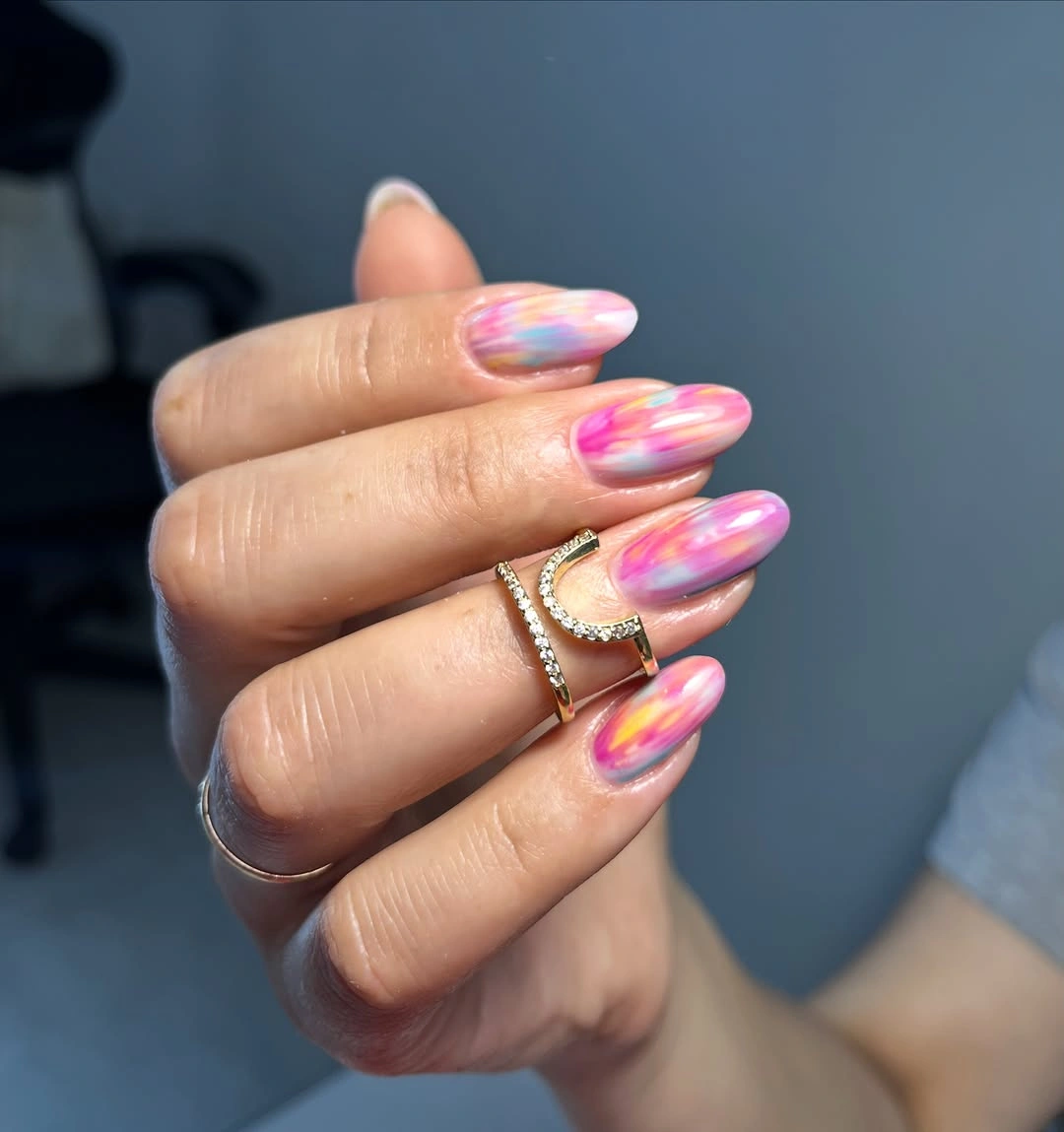 Long almond nails with flowing pastel color streaks