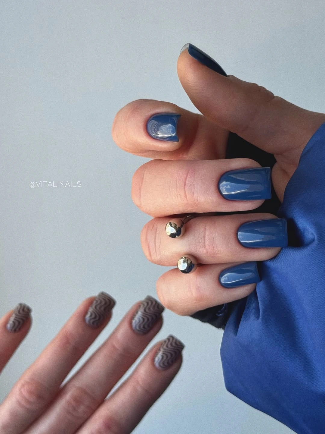 Deep blue square nails with a subtle reflective accent