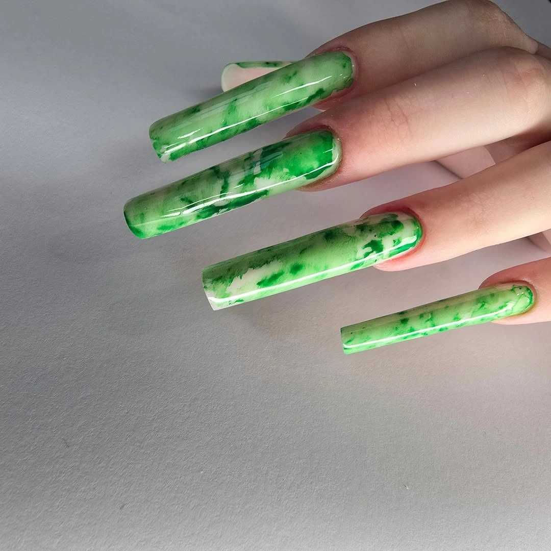 Long square green marbled nails with translucent glossy depth