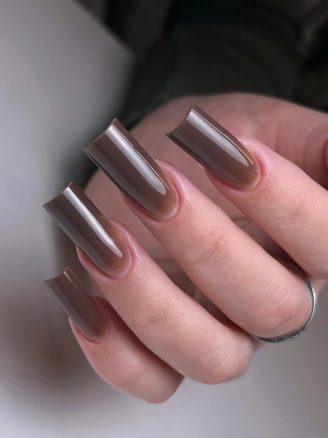 Long square taupe metallic nails with a soft reflective finish
