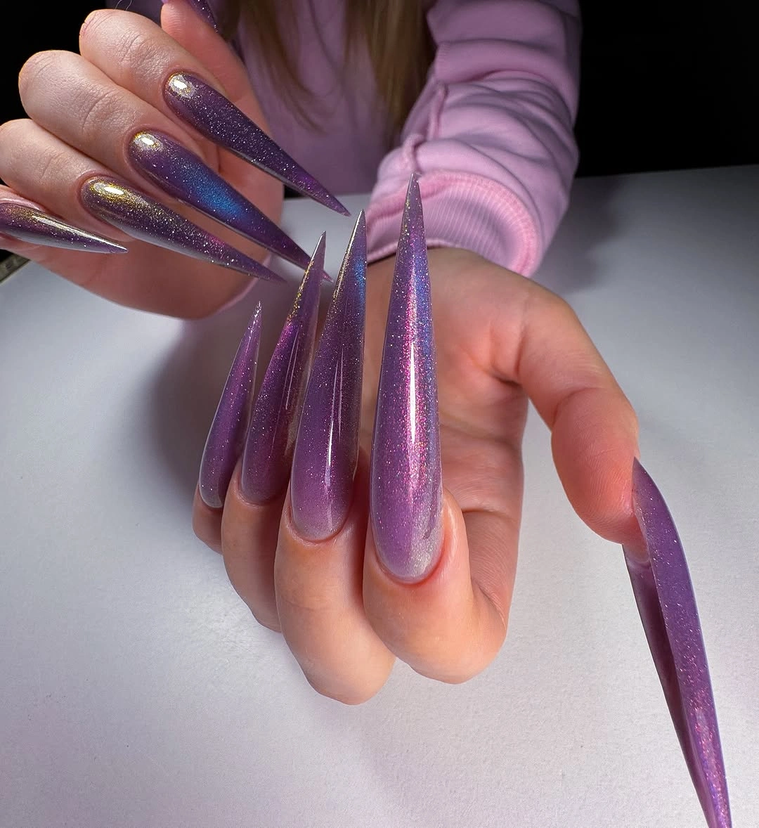 Ultra long purple stiletto nails with pink blue reflective shimmer