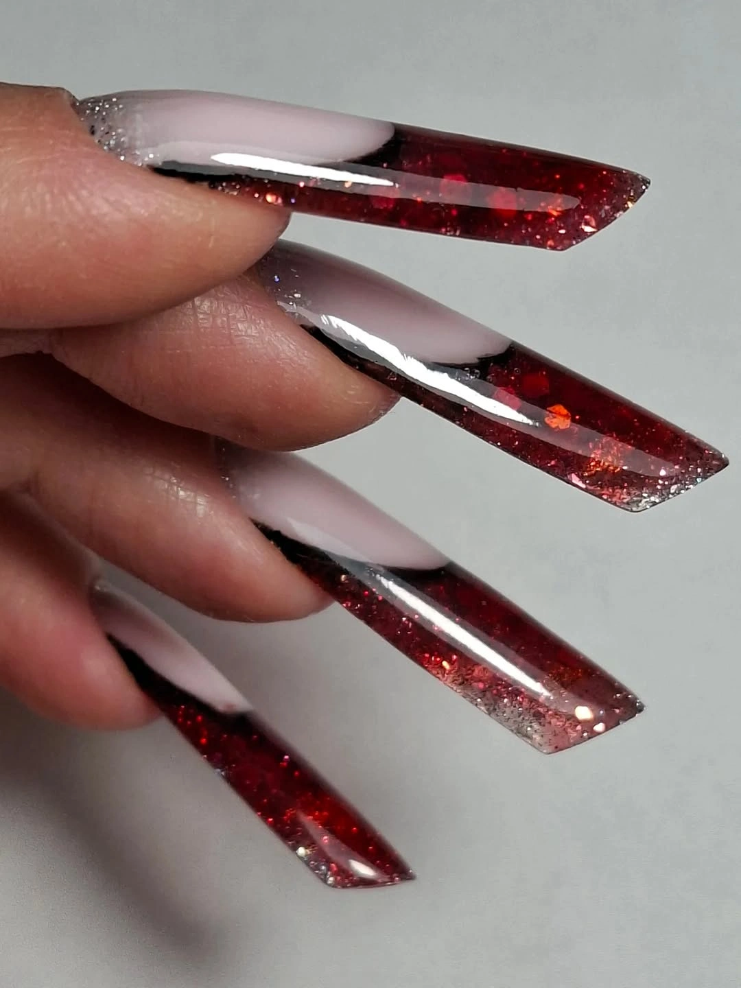 Long tapered square nails with wine glitter tips and pale bases