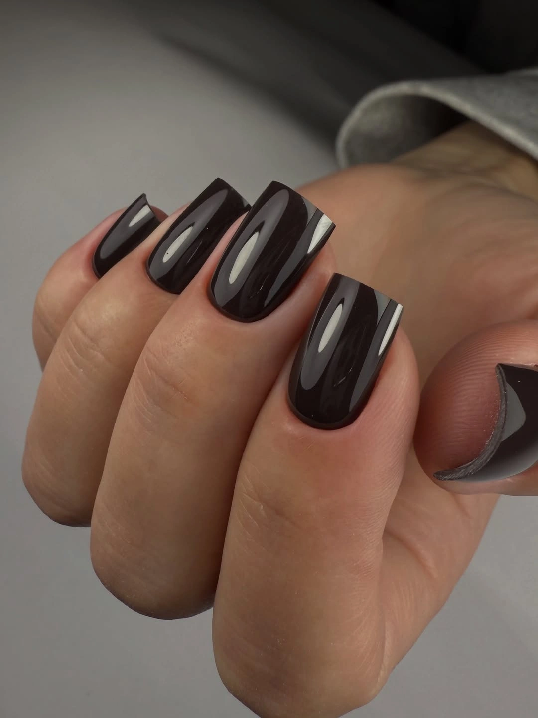 Long oval nails in glossy dark chocolate brown