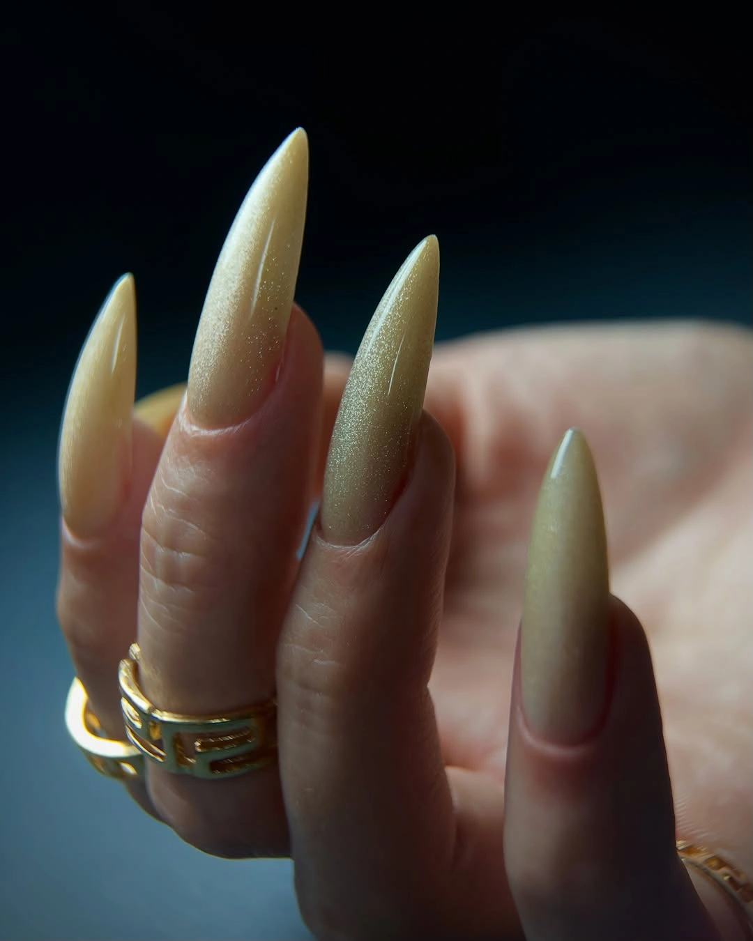 Very long stiletto nails in luminous pearly ivory cream