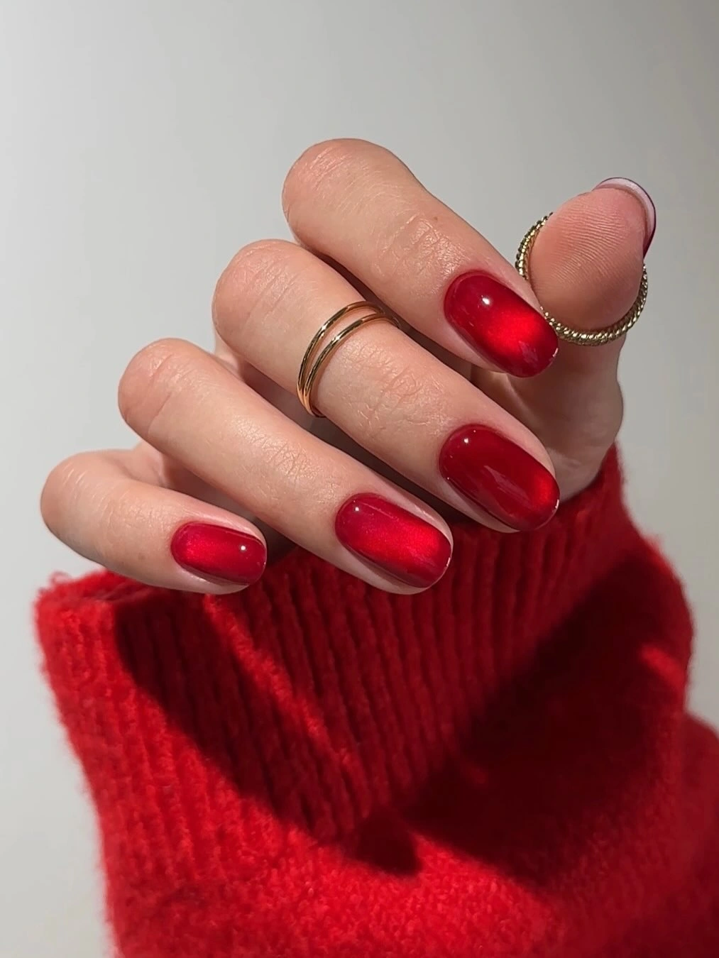 Medium rounded nails in glossy cherry red
