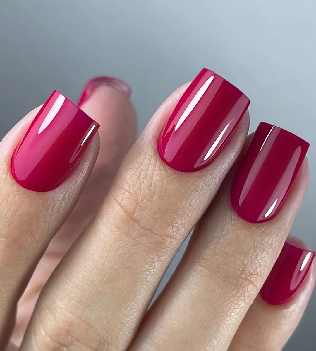 Medium square nails in glossy vivid fuchsia pink