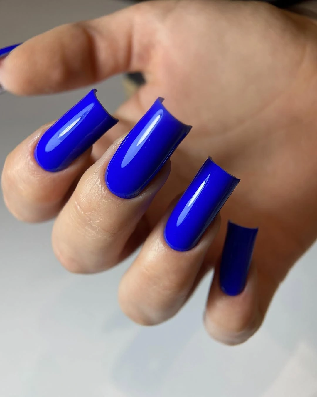 Long square nails in vivid glossy royal blue