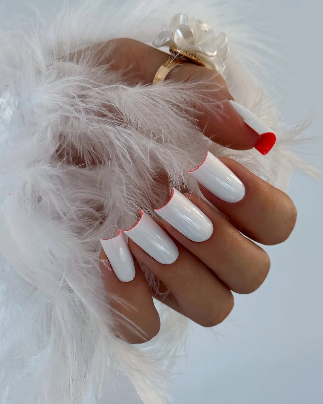 Long almond white nails with narrow red edging