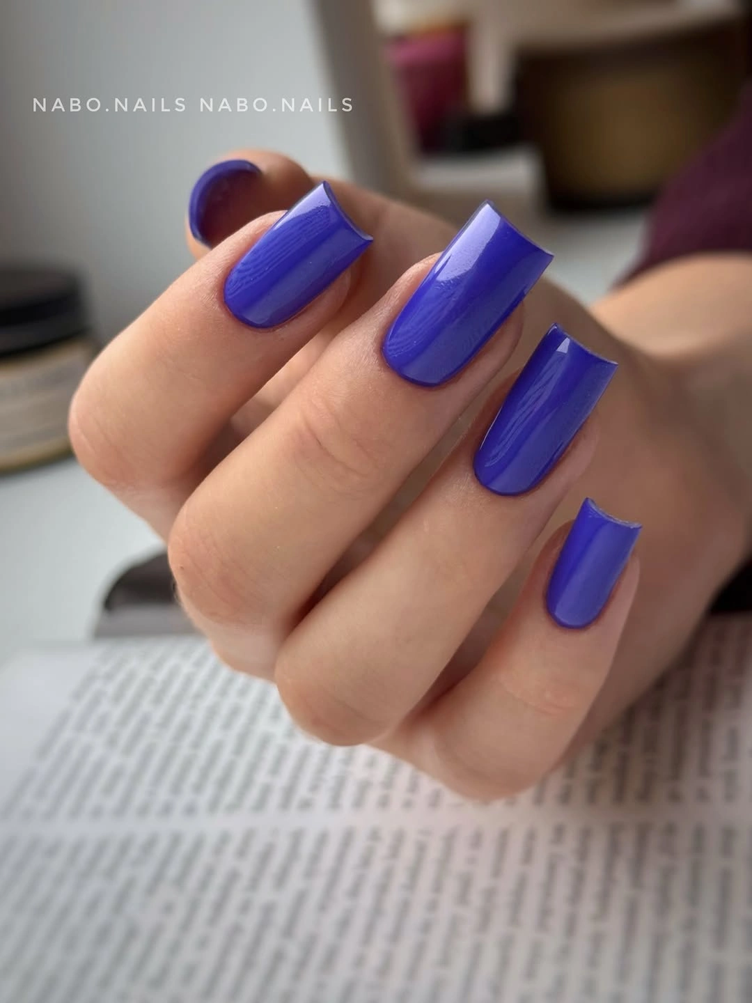 Medium-long square nails in saturated glossy royal purple