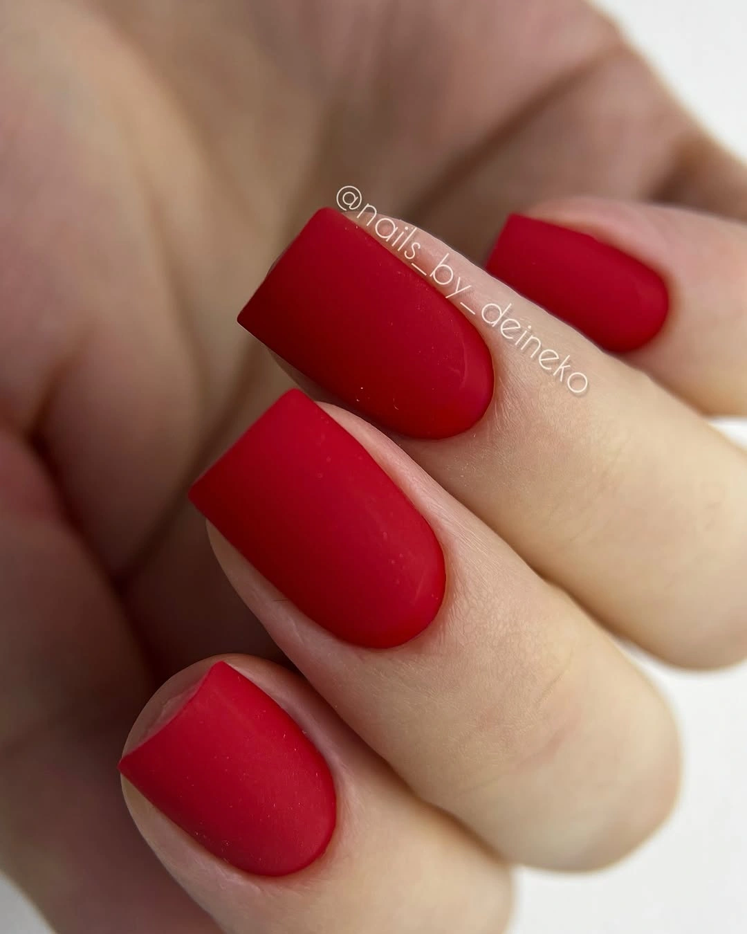 Short square nails in saturated matte red