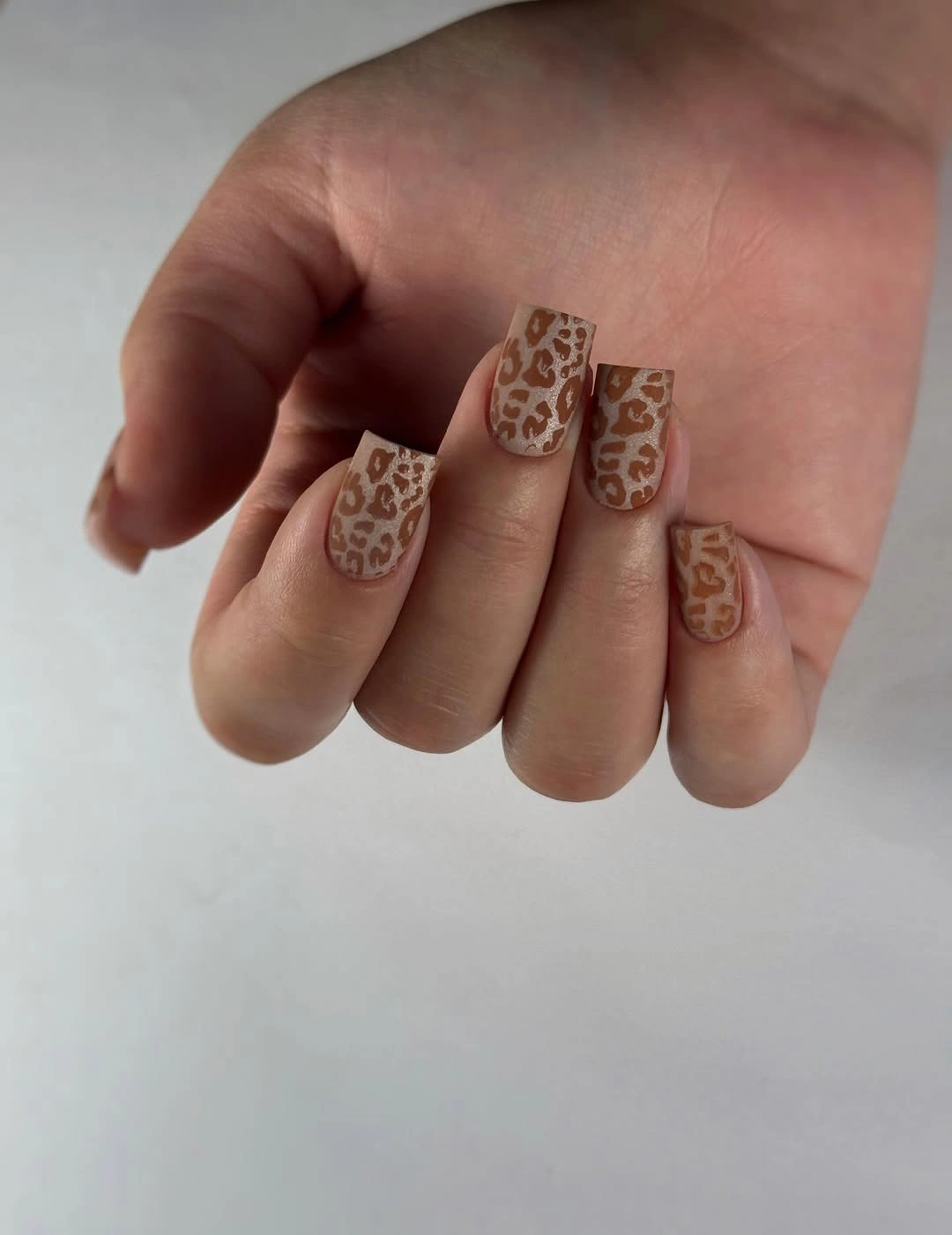 Short nude square nails with spotted patterned tips